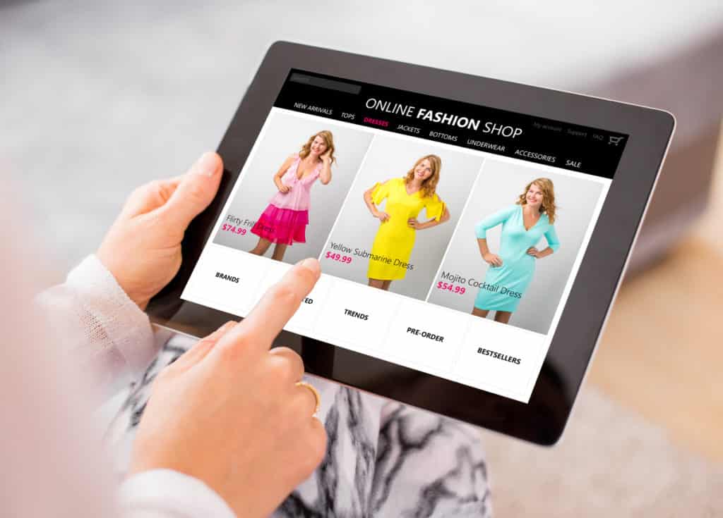 A woman shopping online for a new colourful dress (Personalised Recommendation).