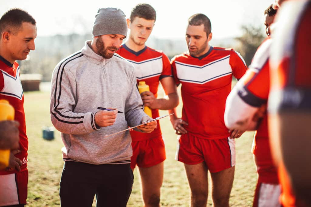 A sports manager having a word with this team